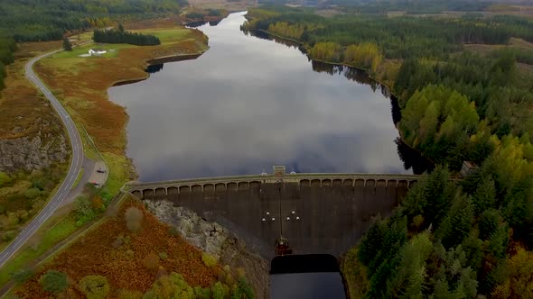 Aerial view of Laggan dam artificial lake and beautiful countryside and wood