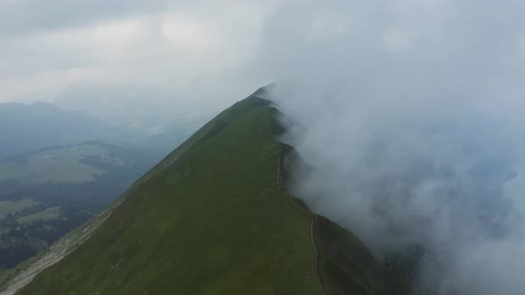 Aerial view of Augstmatthorn mountain with low clouds, Bern, Switzerland.