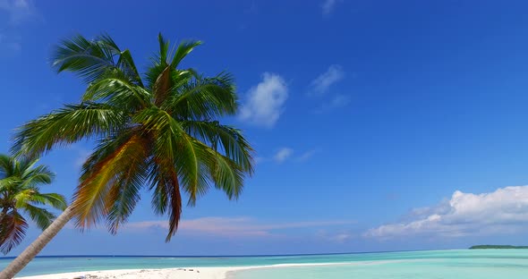 Beautiful birds eye abstract shot of a white sandy paradise beach and aqua blue ocean background in 