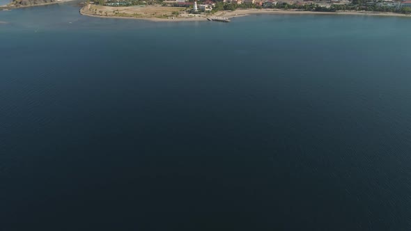 Coastline with Beach and Lighthouse