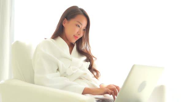 Young asian woman use laptop