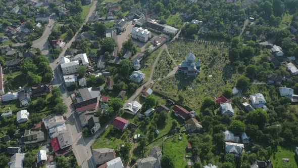 Aerial View of the Church and Cemetery in the Village on a Sunny Summer Day