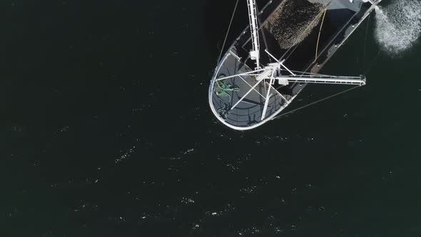 Flying Above Water and then Cathing a Sight of a Fishing Boat