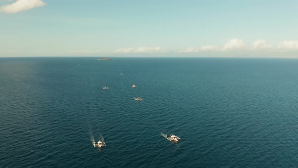 Local Filipino Boats in the Deep Blue Sea