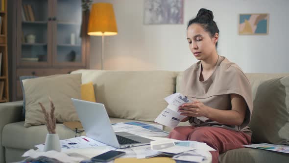 Woman Unfolding Letter With Good News