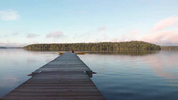 Canoe getting ready to paddle on a calm lake.