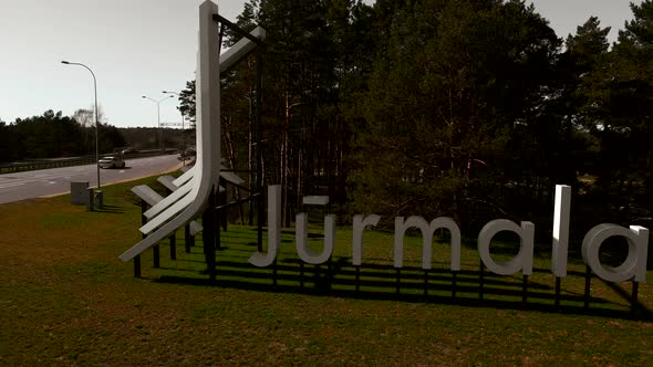 New Jurmala City Entrance Sign  Aerial Orbit Shot