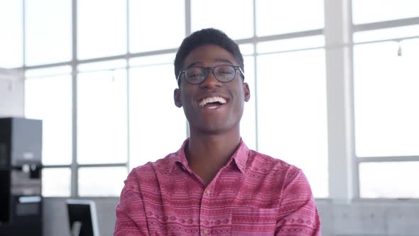 Young handsome African american male executive standing in modern office 4k