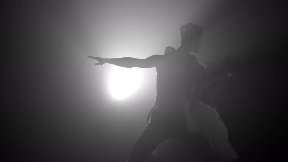 Romantic Professional Ballet Pair Practicing Moves on Dark Stage. Couple Dancing