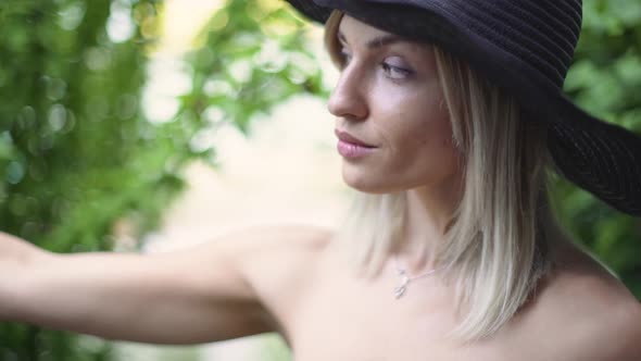 Young Stylish Beautiful Woman in Hat Does Selfie