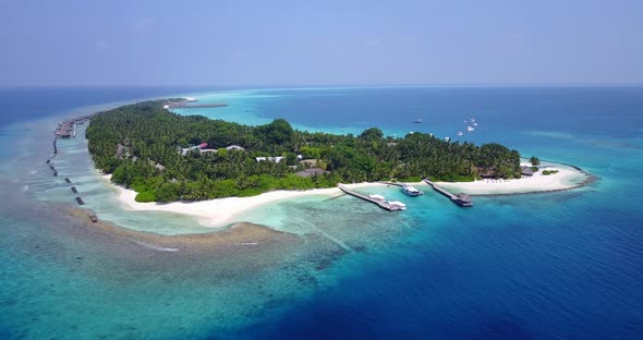 Natural overhead travel shot of a white sand paradise beach and aqua blue water background in high r