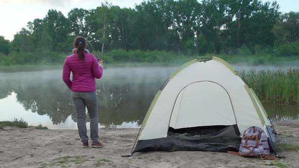 Woman Hiker Enjoying View of Lake in the Morning