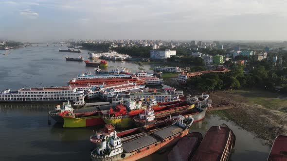 Aerial Over Row Of Disused Ships Buriganga Riverbank In Bangladesh. Dolly Forward