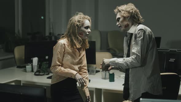 Zombie Man and Woman Talking in Office