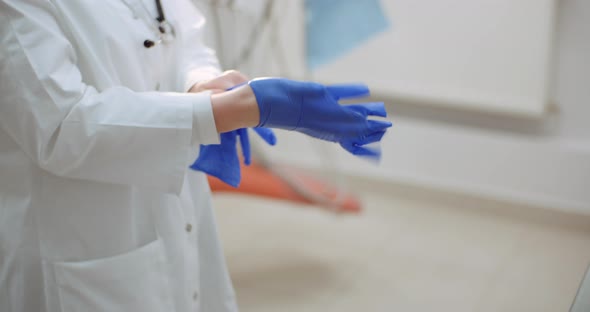 Close Up of Female Scientist Wearing Gloves