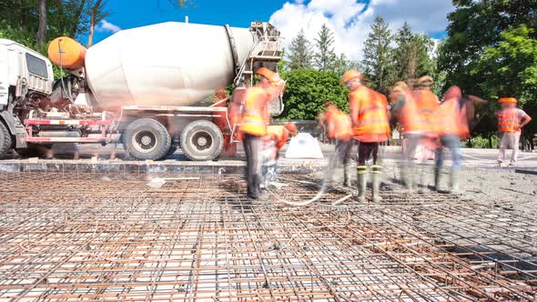 Concrete Works for Road Construction with Many Workers and Mixer Timelapse Hyperlapse