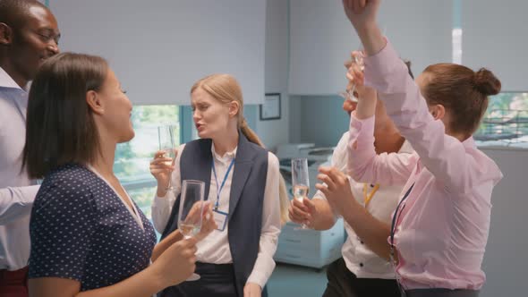 Diverse Group of Joyful Businesspeople Having Party and Dancing in Office