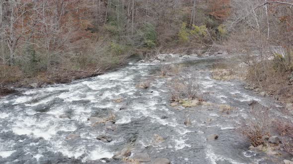 Drone shot of river low altitude flying downstream in late fall in western North Carolina.