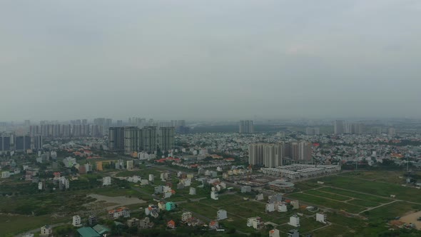 panoramic drone shot of Thu Thiem development area of Ho Chi Minh City with Saigon river, city skyli