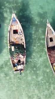 Vertical Video Boats in the Ocean Near the Coast of Zanzibar Tanzania