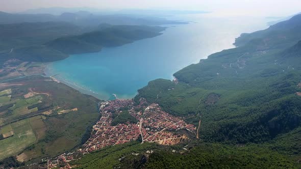 A Small City on a Forested Bay and Fertile Alluvial Plain by the Sea