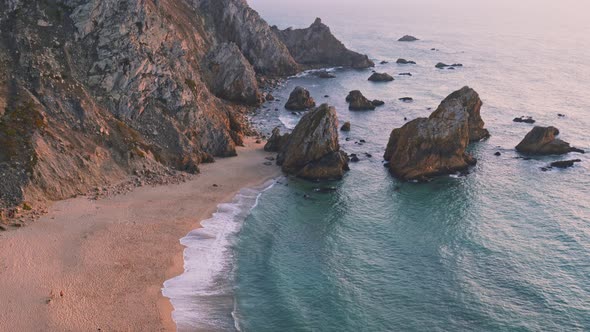  Close Up View of Rocks on Praia Da Ursa Beach in Sintra, Portugal in Sunset Soft Golden Hour Light