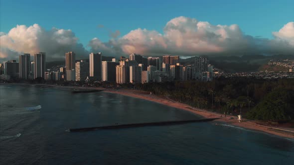 Aerial drone footage of Honolulu, Hawaii. Beautiful real estate, buildings in the city. Palm trees
