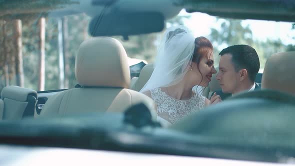 Newlyweds Sitting Car Convertible Look at Each Other Experience Feelings of Tenderness