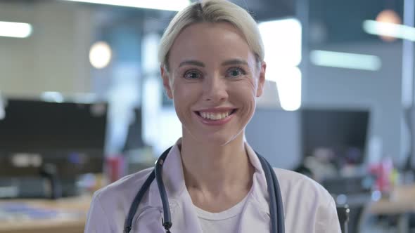 Confident Young Doctor Smiling While Looking at the Camera