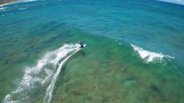 Aerial view of a man kitesurfing in Hawaii