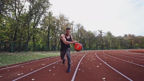 Athlete is Doing Workout in Open Air