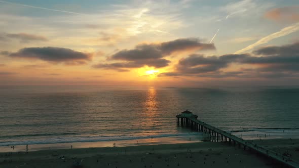 Sunset Scenery At Manhattan Beach Pier In California, USA - aerial drone shot