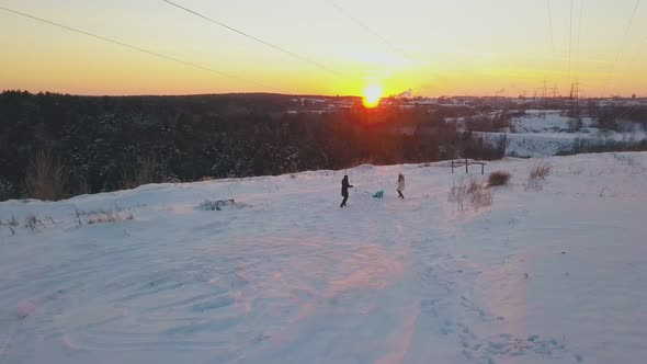 Exciting Family Silhouettes Play Snowballs on Winter Field