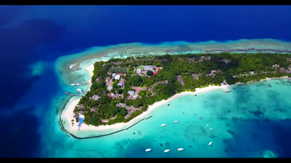 Aerial flying over panorama of relaxing tourist beach adventure by blue water and bright sand backgr