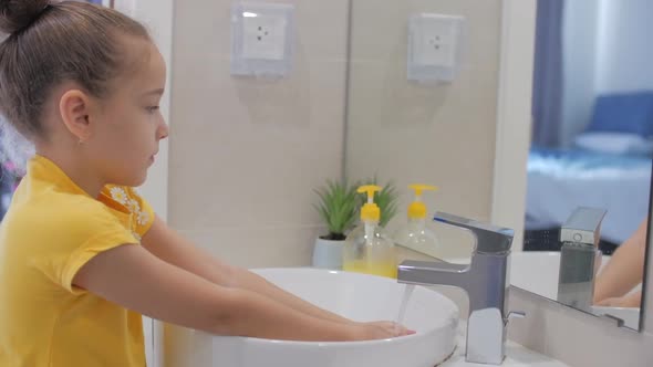 Concept Handwashing. Little Girl or Child Washes Hands with Soap, Hands Washing To Prevention