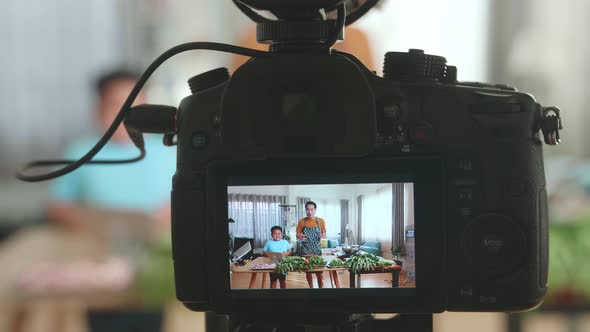 Display Camera Of Asian Father And Son Streaming Live Video With Camera While Cooking At Home