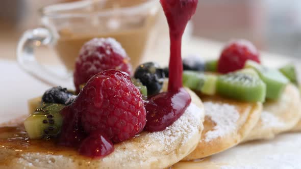 Pancakes With Berry Jam And Fruits. Closeup.