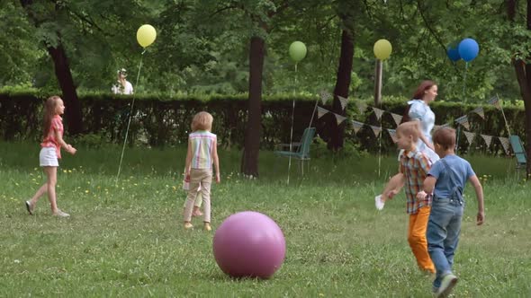 Kids Playing with Toy Balls at the Outdoor Party