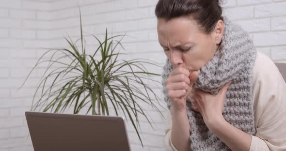 Sneezing Woman on Computer Work