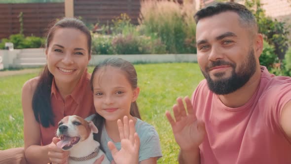 POV Of Cute Family Chilling in Backyard