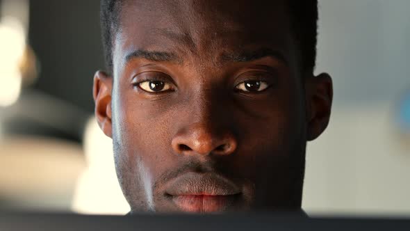 Young freelancer surfing the internet using a laptop