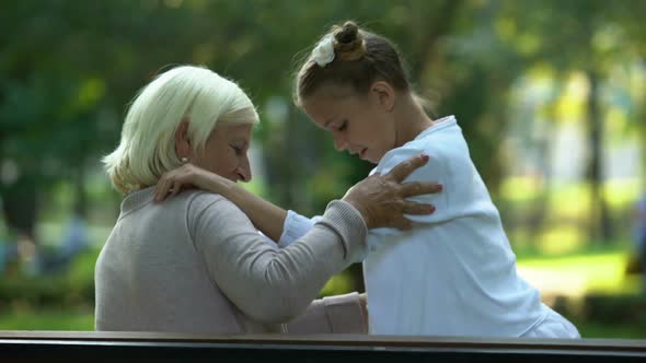 Granny Hugging Granddaughter, Confidential Conversation, Trusting Relations