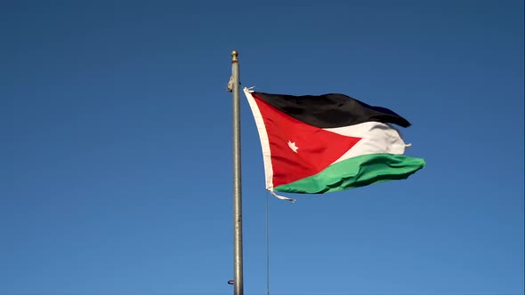 Jordan Flag Waving In The Wind Against Blue Sky