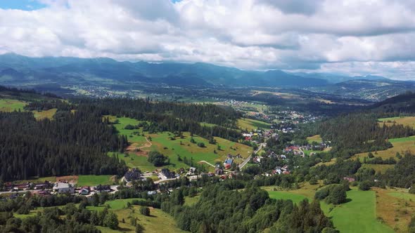 Flight Over a Mountain Cottage Village in Poland, Zakopany, Tatra National Park Aerial 4K Video