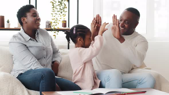 Happy African Family Afro American Parents Helping Black Little Girl Schoolgirl Child Draw Picture