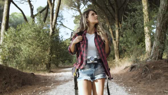 Trekking Girl Walking on Forest Path for Camping