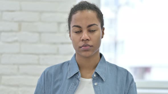 Young African Woman Looking at Camera