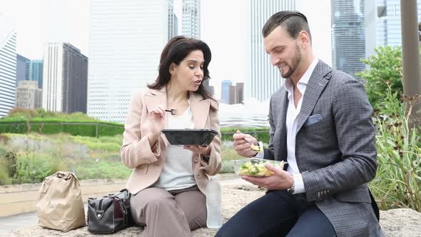 Business people having lunch at park in Chicago