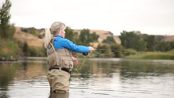Woman Casting A Fly Rod