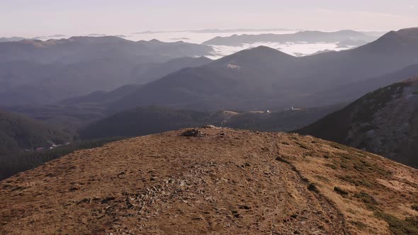 Mountain landscape during dawn on autumn morning from aerial view.